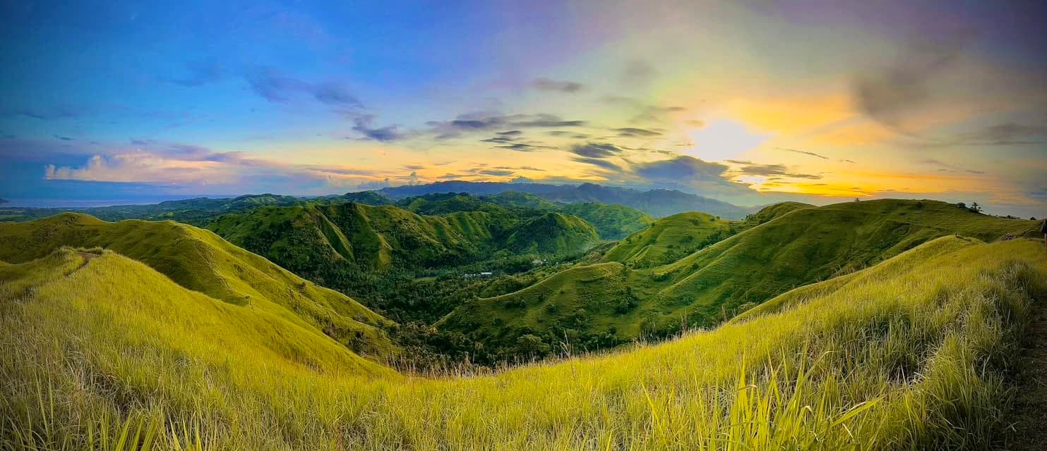 Wide landscape sweep showing the undulating contours of Kankoka Hills