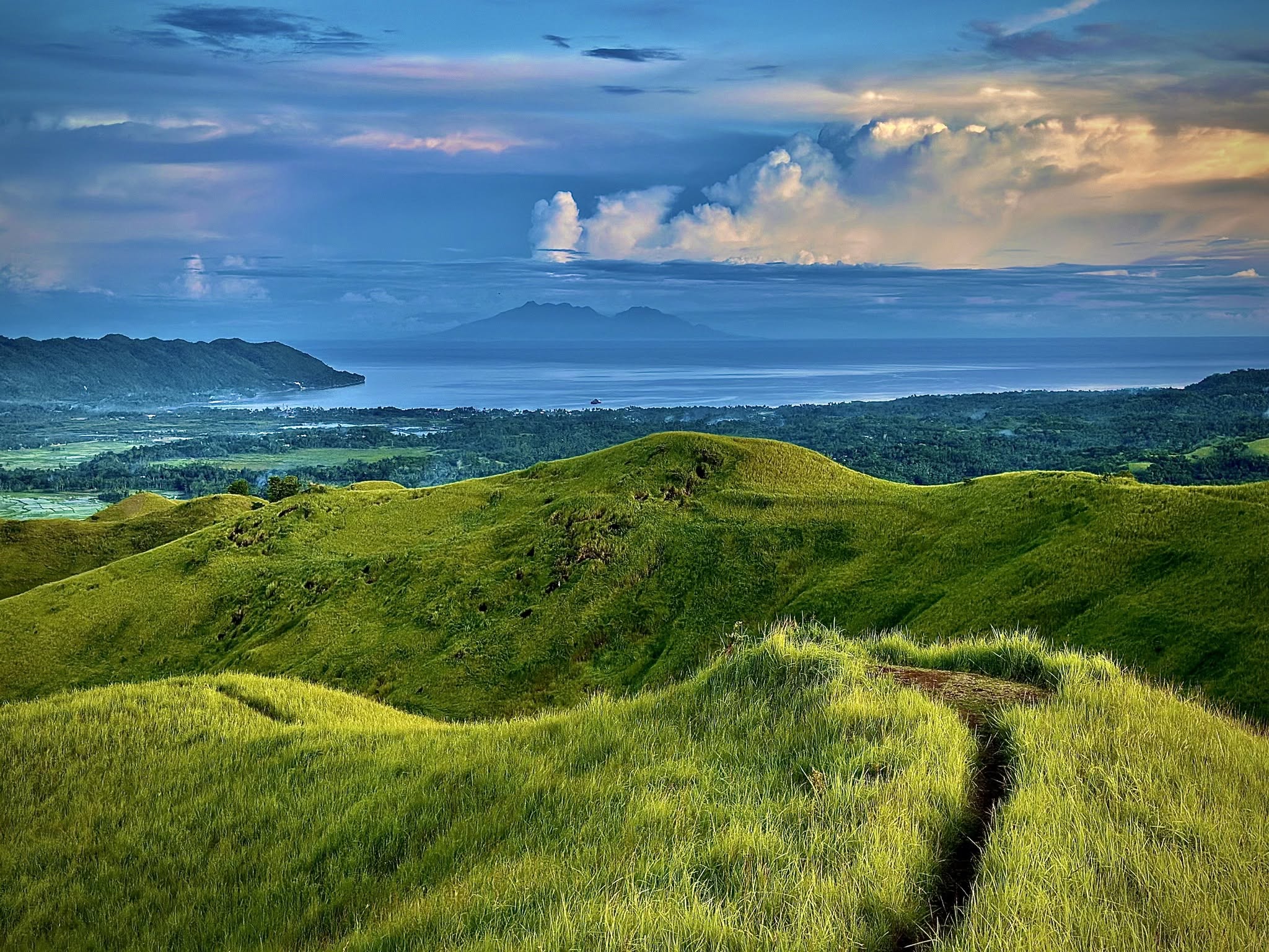 Vast panoramic view of rolling green hills in Candijay, Bohol
